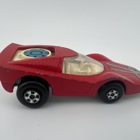 red futuristic race car diecast toy bubble canopy side view left profile vintage model