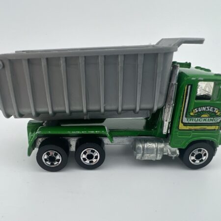 green dump truck diecast vehicle raised bed side view left profile construction toy