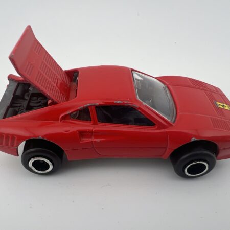 red sports car diecast vehicle rear engine open hood side view vintage toy