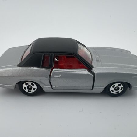 silver coupe diecast car black roof side view right profile vintage model