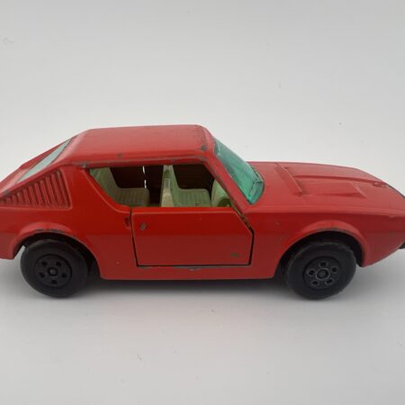 red compact diecast car vintage toy side view right profile hatchback style