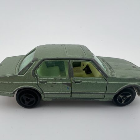 green diecast sedan vintage toy car side view right profile classic model