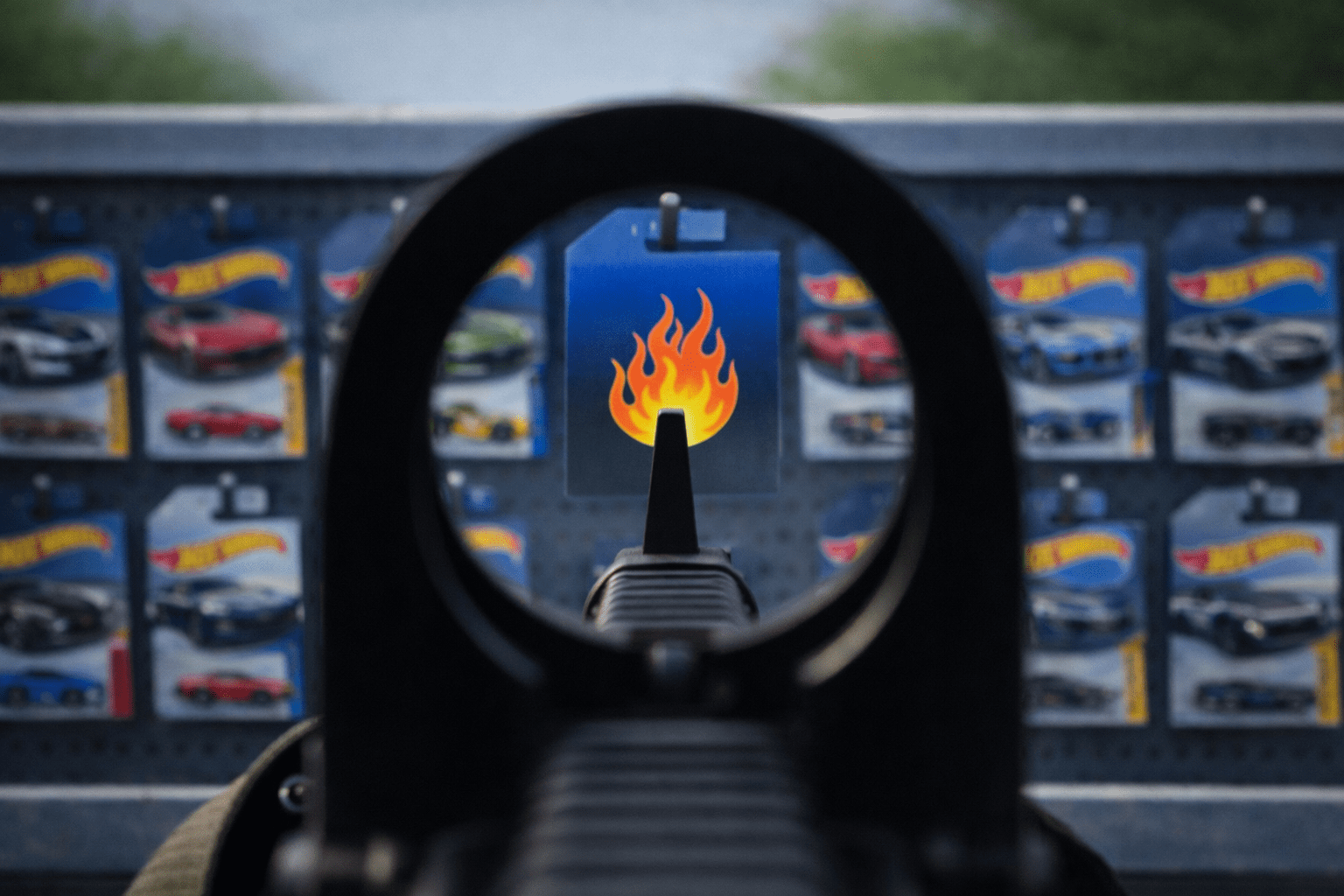 Hot Wheels treasure hunt car aligned through M16 iron sights representing an experienced collector spotting rare diecast cars