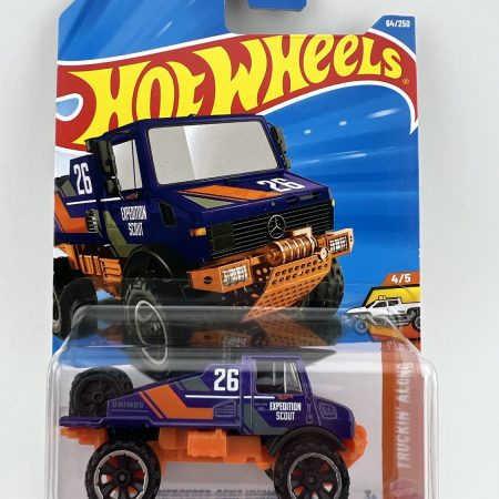 Hot Wheels Mercedes-Benz Unimog 1300L Truckin Along diecast truck in original packaging with themed artwork and Mattel branding, 1:64 scale collectible