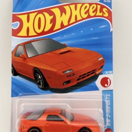 Hot Wheels 1989 Mazda Savanna RX-7 FC3S diecast car in original packaging with colorful artwork and Mattel branding, HW J-Imports series, 1:64 scale collectible